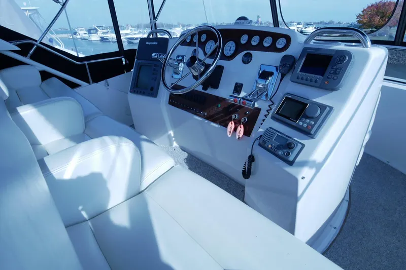 Slide: The Image of Interior helm of 2000 Silverton 392 Motor Yacht with navigation instruments and steering wheel. - 13