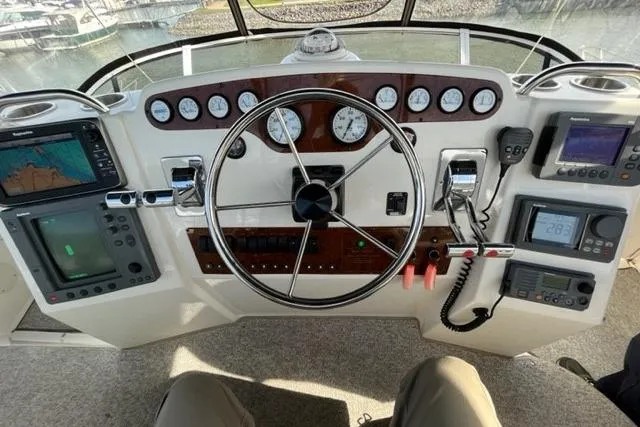 Slide: The Image of Cockpit view of a 2000 Silverton 392 Motor Yacht with navigation instruments. - 11