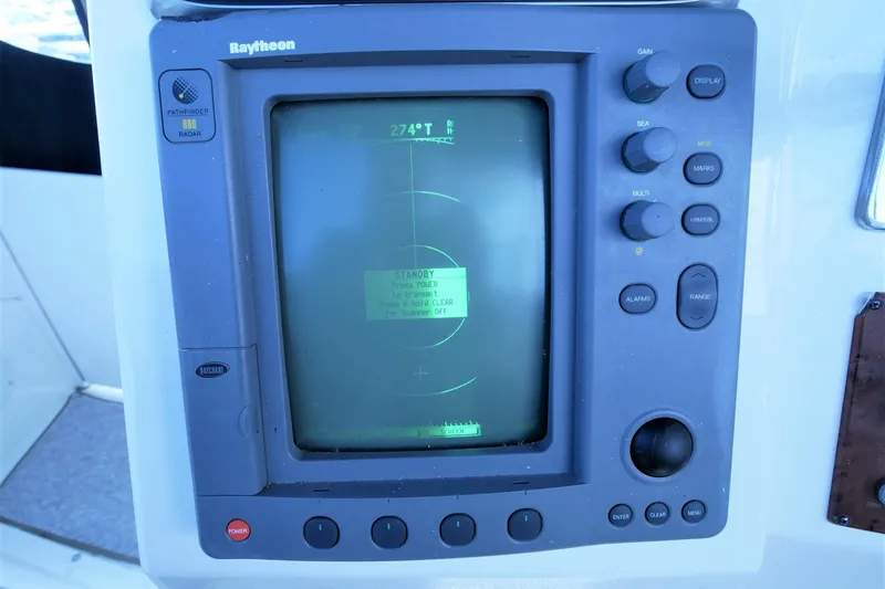 Slide: The Image of Raytheon radar display on 2000 Silverton 392 Motor Yacht dashboard. - 16