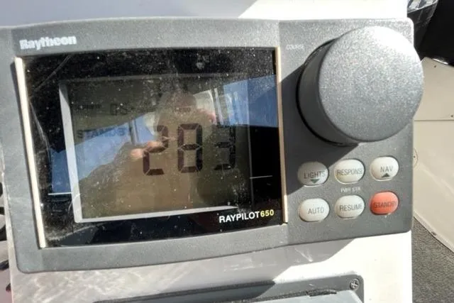 Slide: The Image of Raytheon Raypilot 650 display on 2000 Silverton 392 Motor Yacht, showing heading 283. - 17