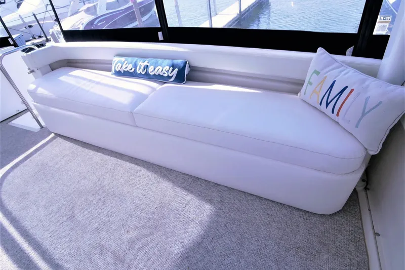 Slide: The Image of Luxurious seating area on 2000 Silverton 392 Motor Yacht with decorative pillows. - 26
