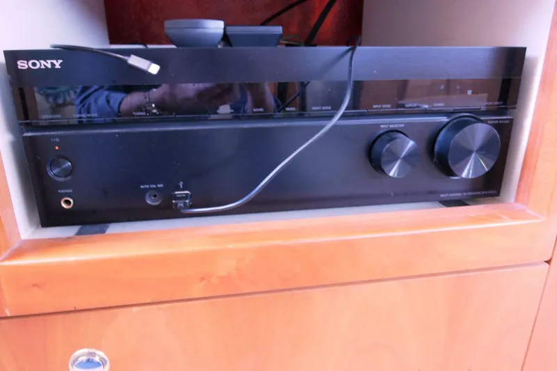 Slide: The Image of Sony audio receiver in a 2000 Silverton 392 Motor Yacht's wooden cabinet. - 34
