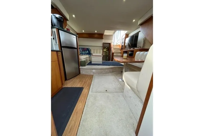 Slide: The Image of Interior of 2000 Silverton 392 Motor Yacht with modern amenities and cozy seating. - 39