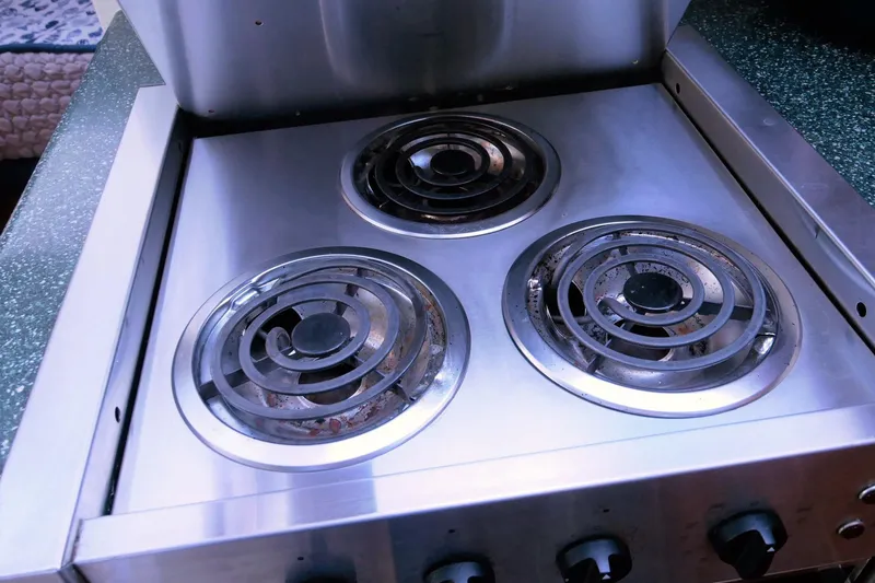 Slide: The Image of Stainless steel stove with three burners on a 2000 Silverton 392 Motor Yacht. - 46
