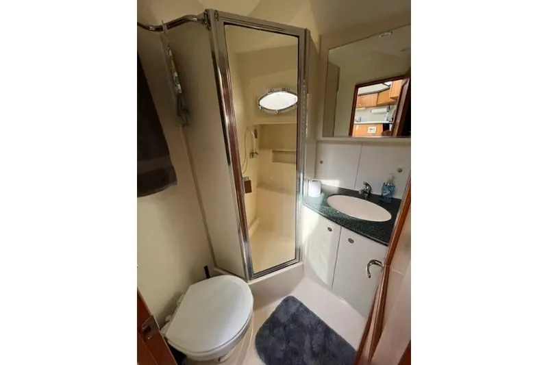 Slide: The Image of Bathroom interior of 2000 Silverton 392 Motor Yacht with shower and sink. - 60