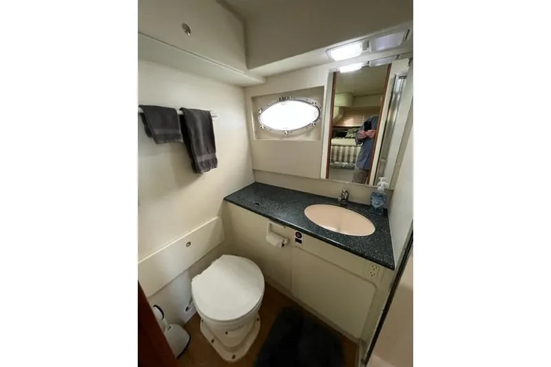 Slide: The Image of Bathroom interior of 2000 Silverton 392 Motor Yacht with sink and toilet. - 61
