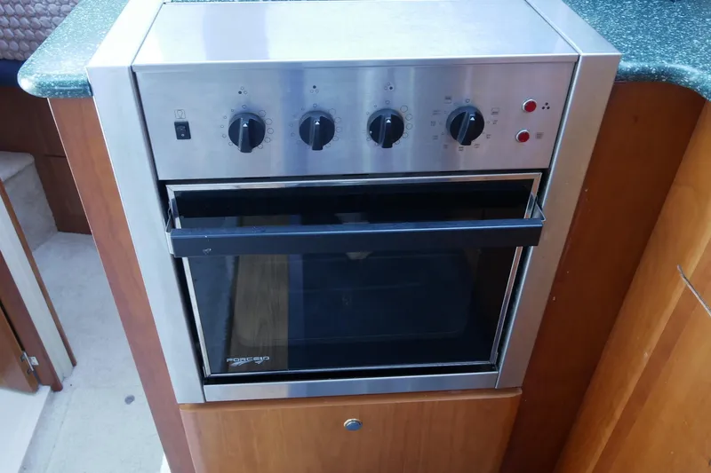 Slide: The Image of Stainless steel oven in 2000 Silverton 392 Motor Yacht kitchen. - 45