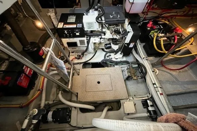 Slide: The Image of Engine room of 2000 Silverton 392 Motor Yacht with visible machinery and wiring. - 67