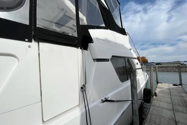 Slide: The Image of 2000 Silverton 392 Motor Yacht docked, showcasing sleek design and spacious cabin. - 7