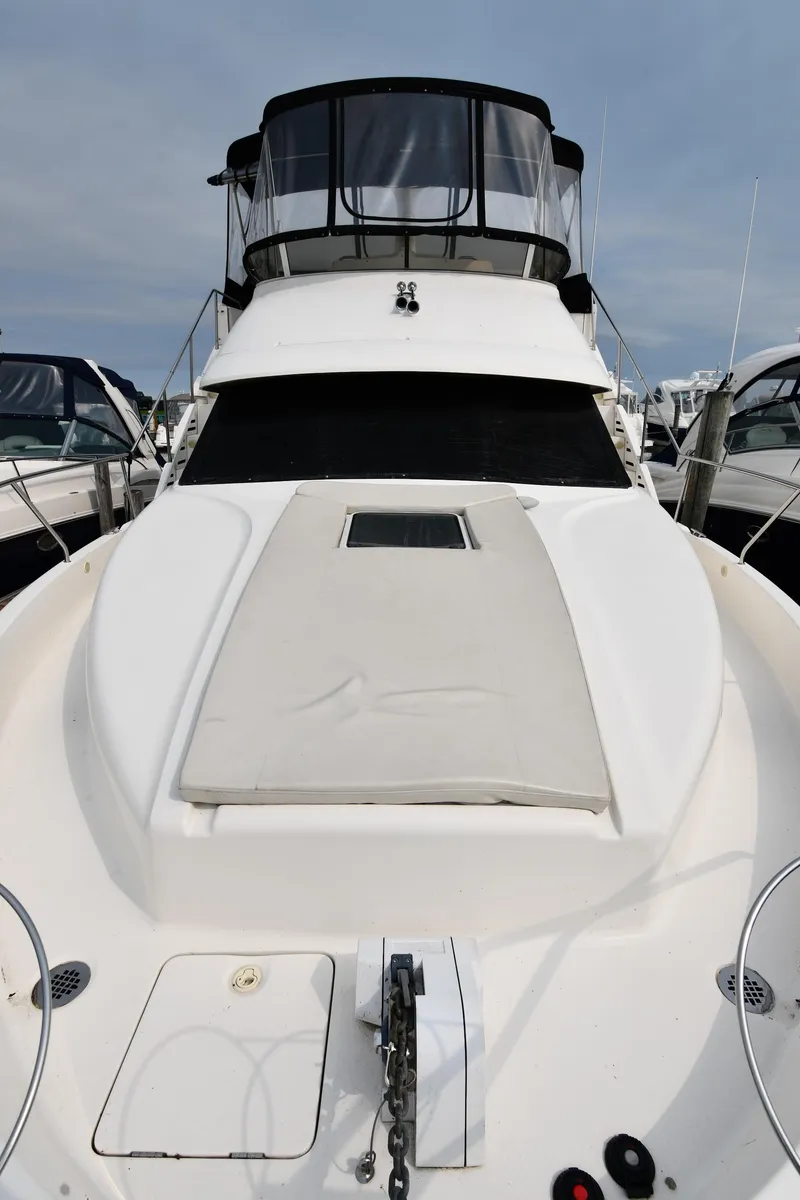 Slide: The Image of 2000 Silverton 392 Motor Yacht, front view in marina. - 2