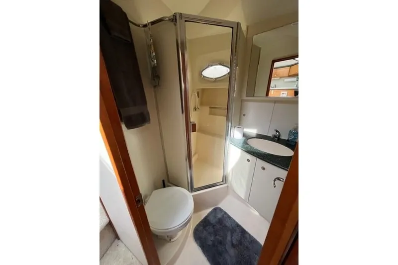 Slide: The Image of Bathroom interior of 2000 Silverton 392 Motor Yacht with shower and vanity. - 59