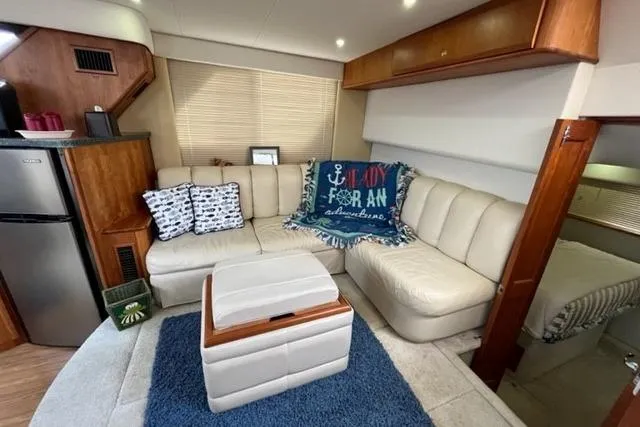 Slide: The Image of Interior of 2000 Silverton 392 Motor Yacht with cozy seating and nautical decor. - 36