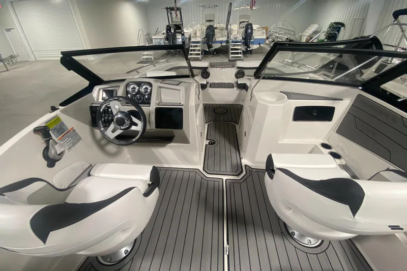 Slide: The Image of 2026 Starcraft SVX 210 boat interior with modern dashboard and seating. - 23