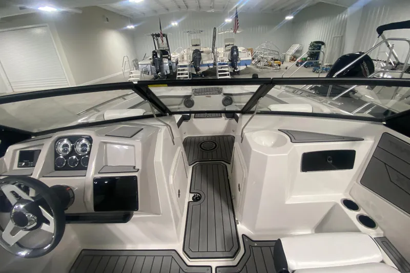 Slide: The Image of 2026 Starcraft SVX 210 boat interior with modern dashboard and seating. - 26
