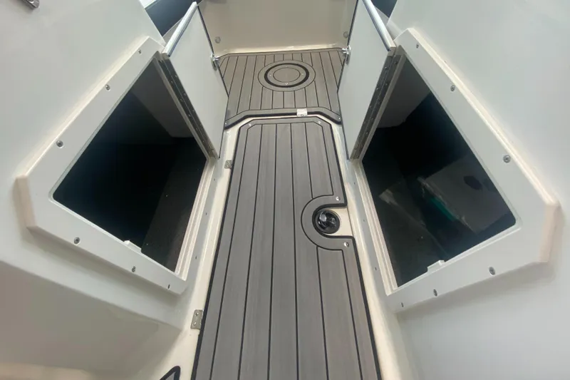 Slide: The Image of 2024 Starcraft SVX 190 boat interior with open storage compartments and non-slip flooring. - 10