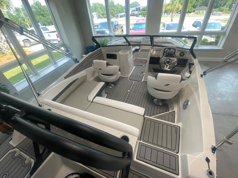 Slide: The Image of 2024 Starcraft SVX 190 boat interior with seating and control console. - 4