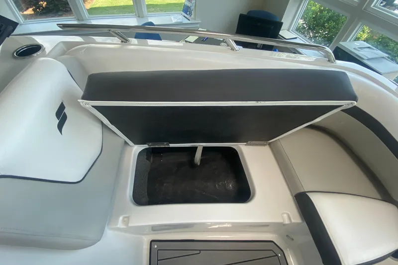 Slide: The Image of 2024 Starcraft SVX 190 boat interior storage compartment with open seat. - 16