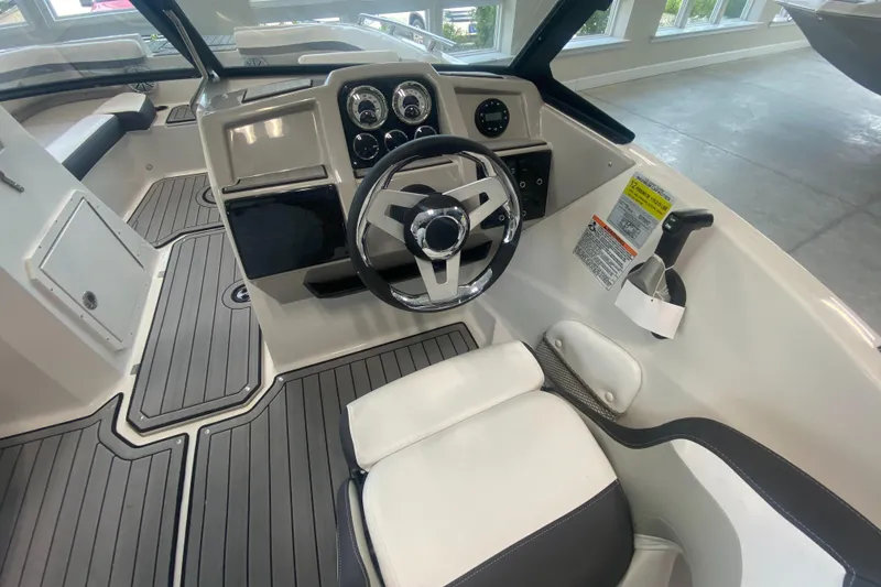 Slide: The Image of 2024 Starcraft SVX 190 boat interior with steering wheel and dashboard. - 9
