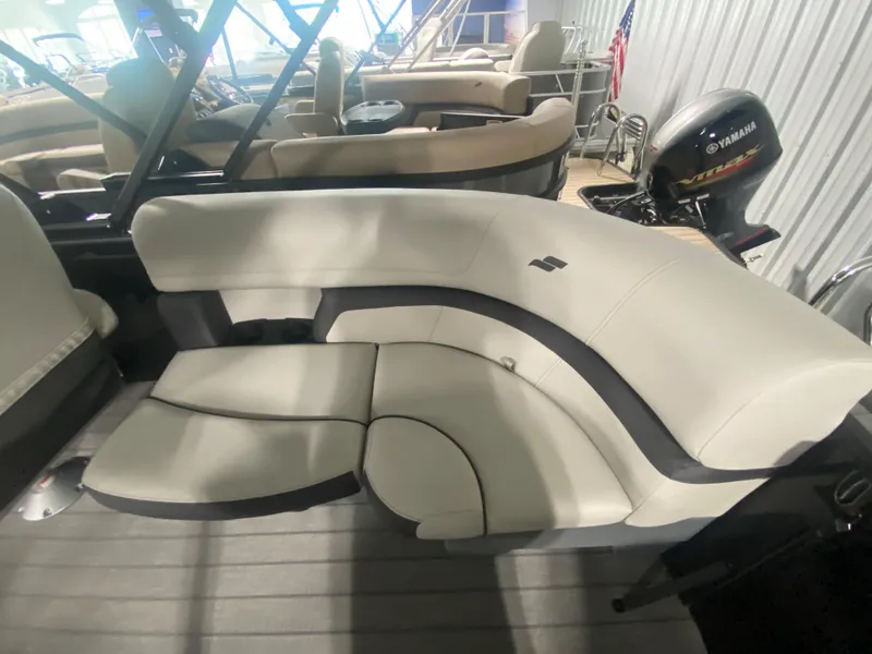 Slide: The Image of 2024 Starcraft EXS 1 boat interior with beige seating and Yamaha outboard motor. - 10