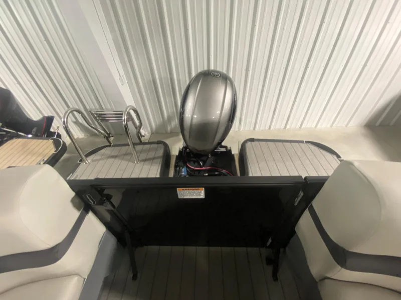 Slide: The Image of 2024 Starcraft EXS 1 boat interior with motor and seating. - 17