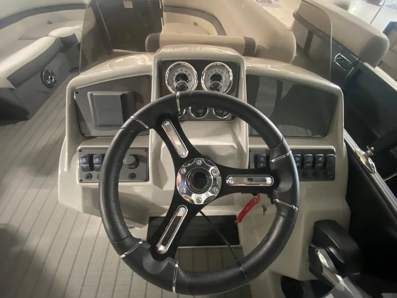 Slide: The Image of 2024 Starcraft EXS 1 boat dashboard with steering wheel and control panel. - 6