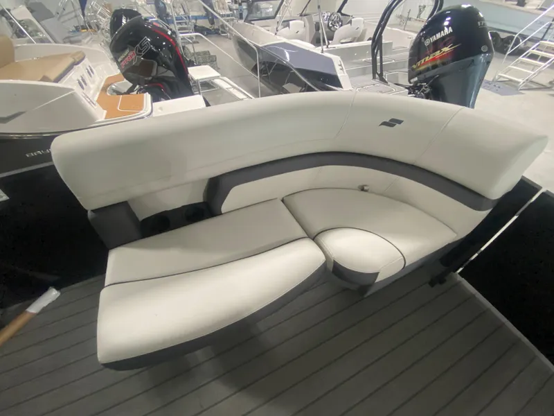 Slide: The Image of 2024 Starcraft EXS 1 boat with white and gray seating. - 7