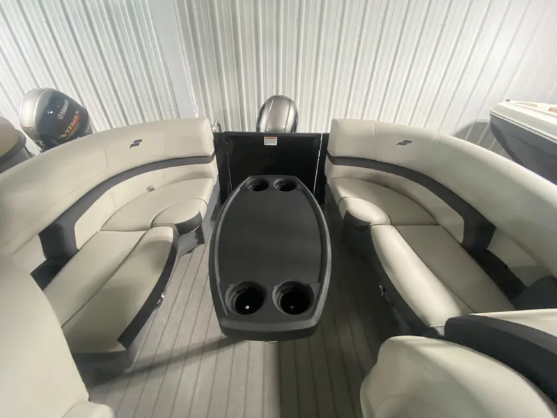 Slide: The Image of 2024 Starcraft EXS 1 boat interior with cushioned seating and central table. - 19