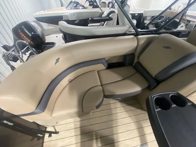 Slide: The Image of 2024 Starcraft EXS 1 boat interior with beige and gray seating. - 7