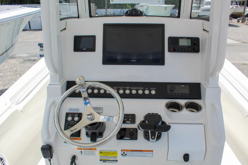 Slide: The Image of 2024 Regulator 23 boat dashboard with Garmin display and Yamaha controls. - 11
