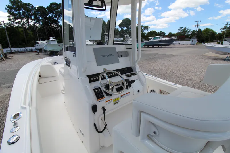 Slide: The Image of 2024 Regulator 23 boat interior with Garmin navigation system. - 21