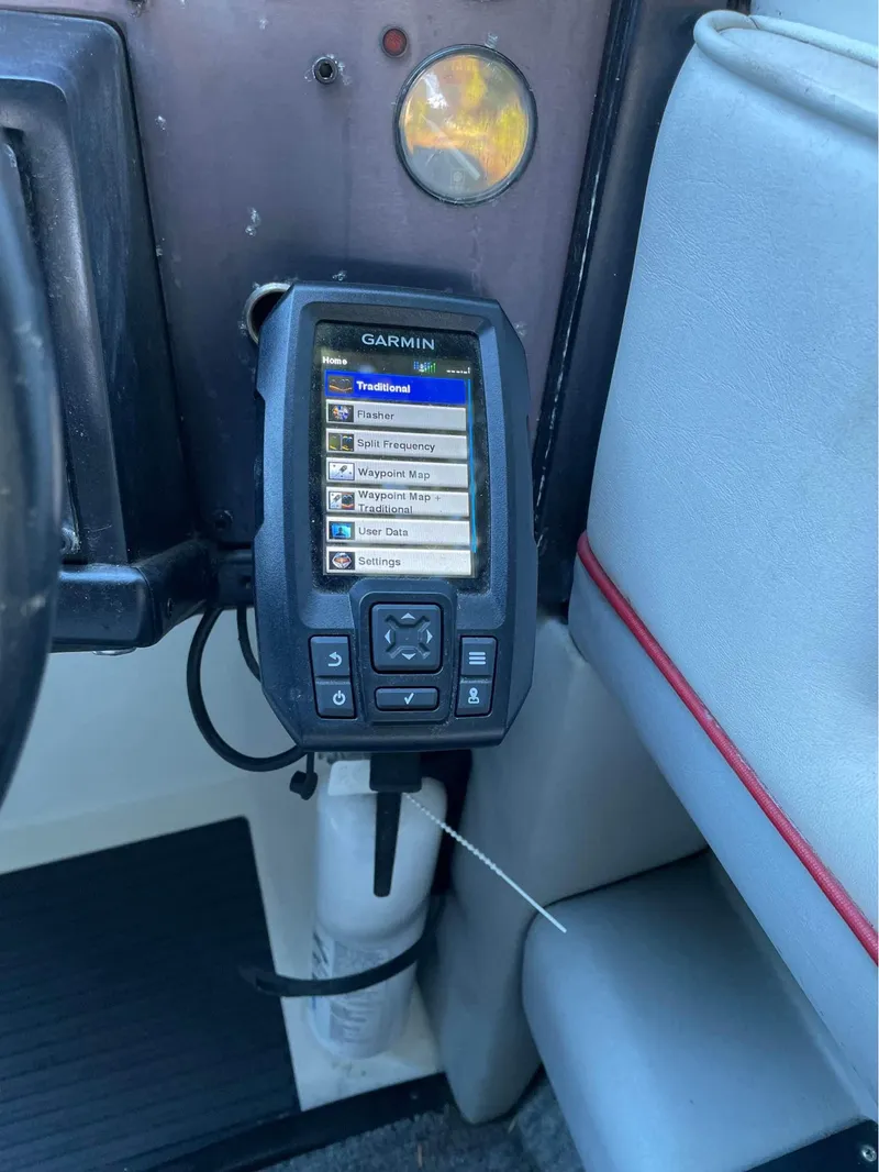 Slide: The Image of Garmin navigation device in a 1989 Cobalt CONDURRE boat cockpit. - 1