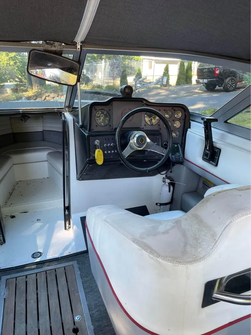 Slide: The Image of 1989 Cobalt CONDURRE boat interior with steering wheel and dashboard. - 2