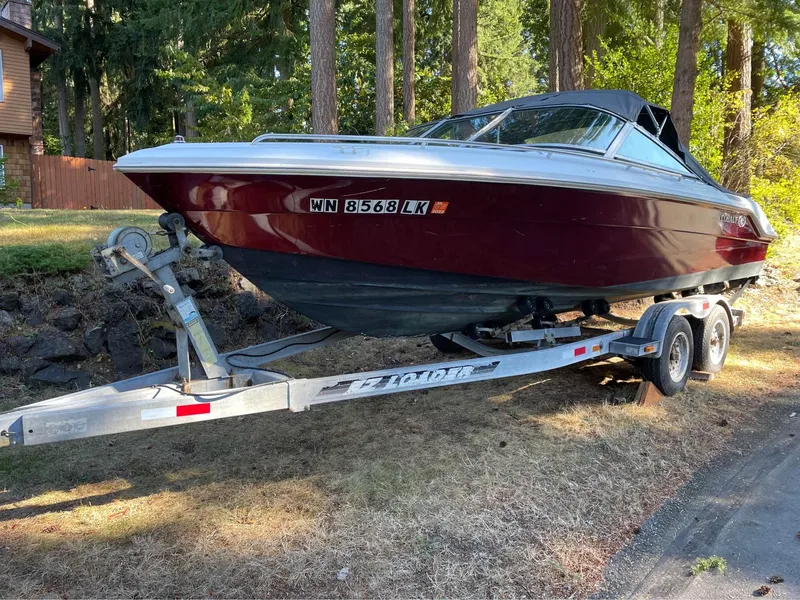 Slide: The Image of 1989 Cobalt CONDURRE boat on a trailer in a wooded area. - 4