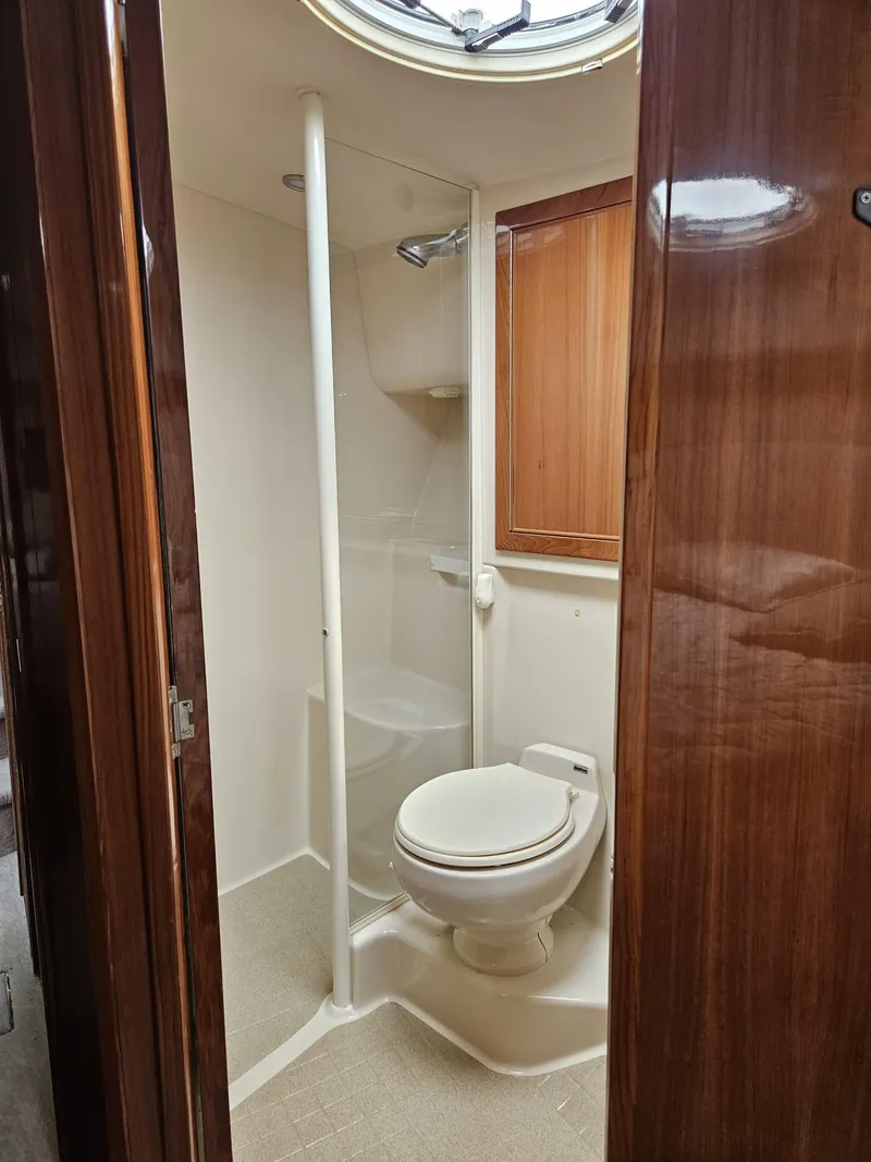 Slide: The Image of Bathroom interior of 2007 Riviera 42 yacht with shower and toilet. - 10