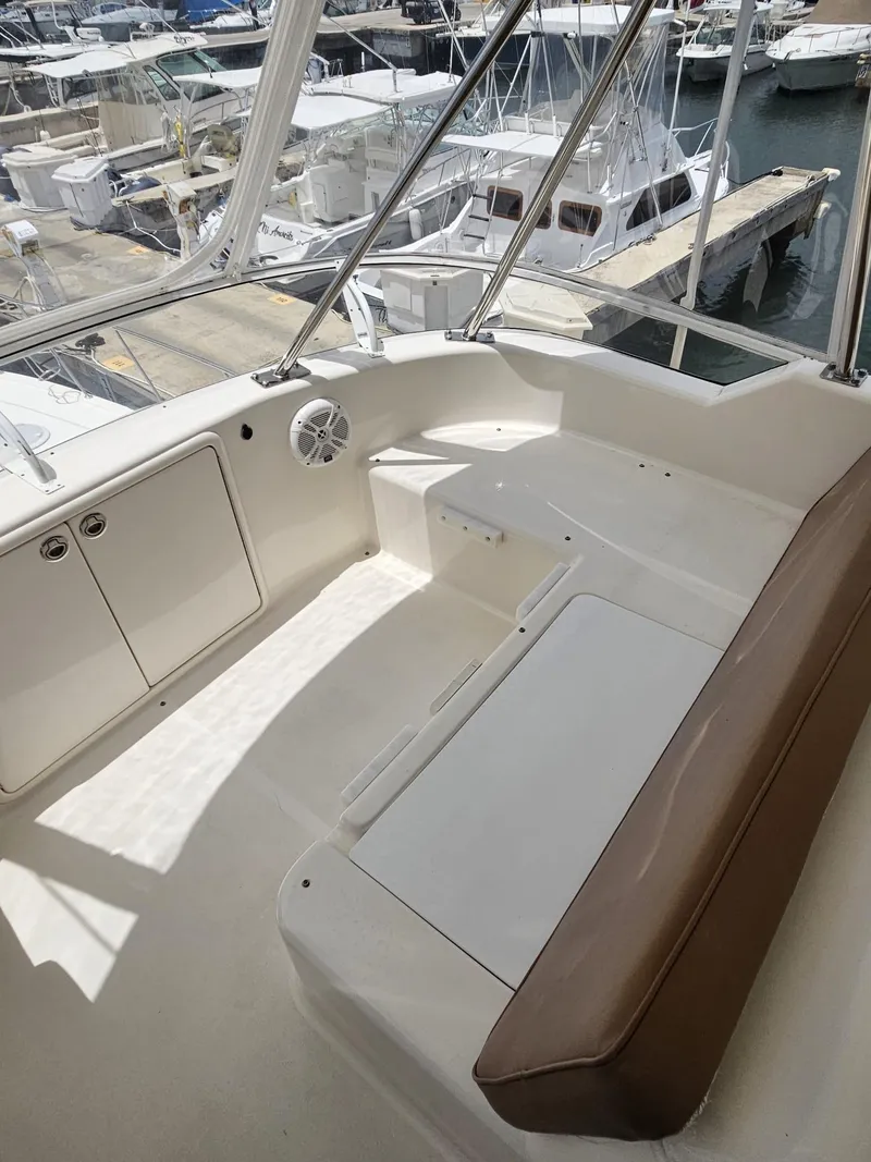 Slide: The Image of 2007 Riviera 42 yacht interior with seating, docked at marina. - 15