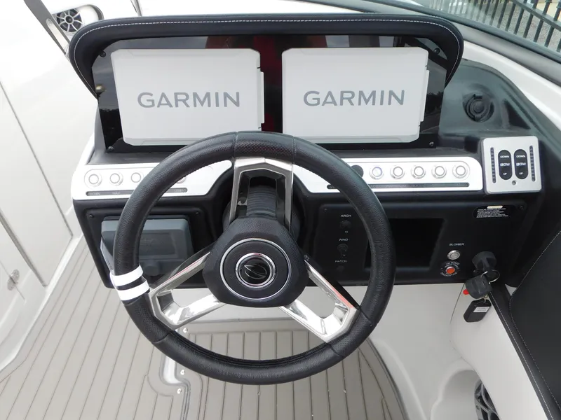 Slide: The Image of 2024 Crownline 280 SS boat interior with adjustable seating and modern design. - 5