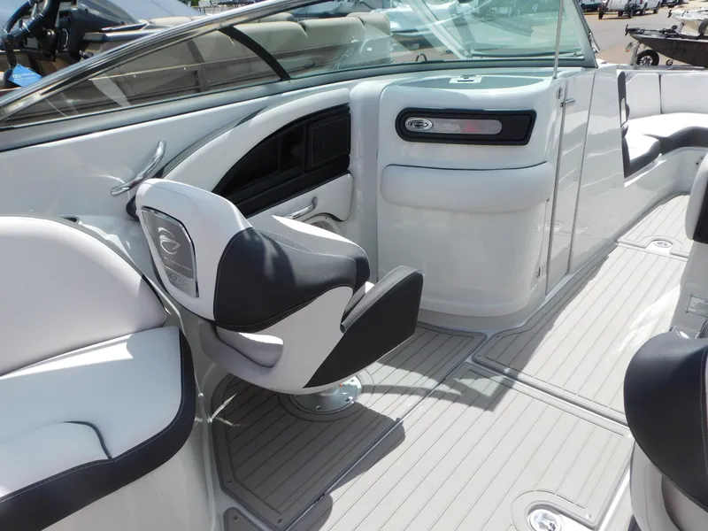 Slide: The Image of 2024 Crownline 280 SS boat interior with speaker, control panel, and blue LED lighting. - 6