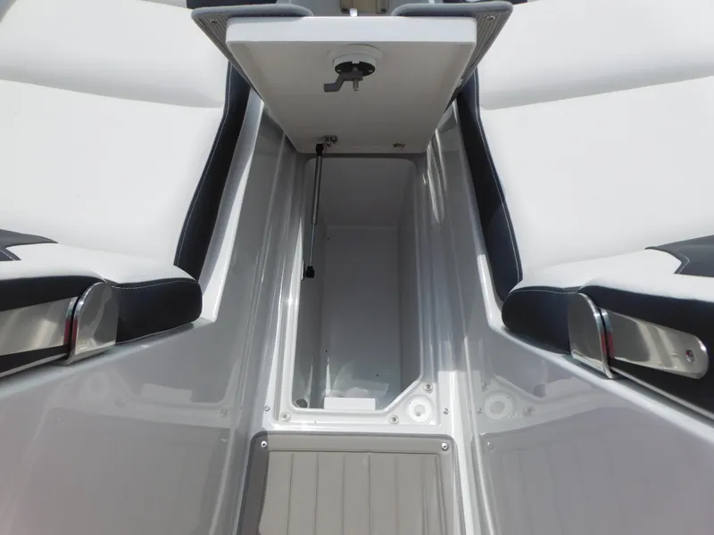 Slide: The Image of 2024 Crownline 280 SS boat interior with spacious seating and modern design in showroom. - 8
