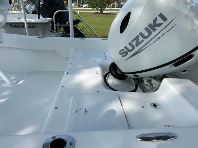 Slide: The Image of 2024 Savannah SS19 boat with Suzuki outboard motor. - 8