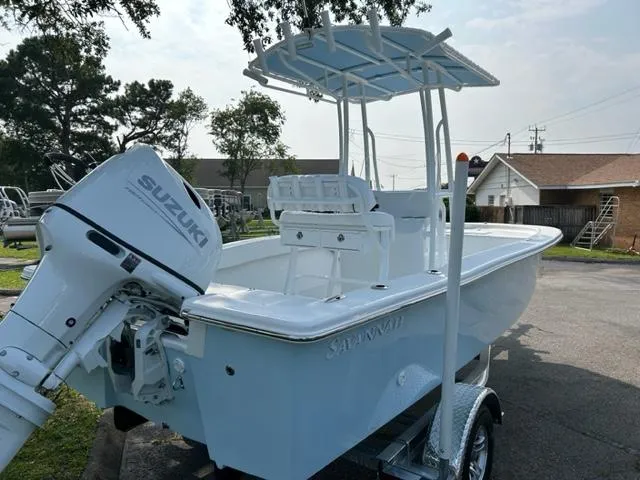 Slide: The Image of 2024 Savannah SS19 boat with Suzuki outboard motor on trailer. - 3