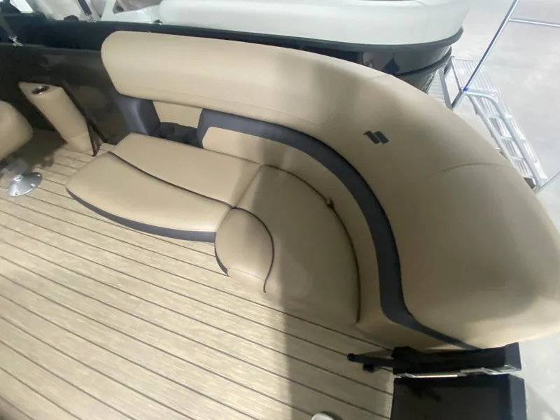 Slide: The Image of 2024 Starcraft EXS 1 boat with beige and gray seating on a wooden deck. - 20