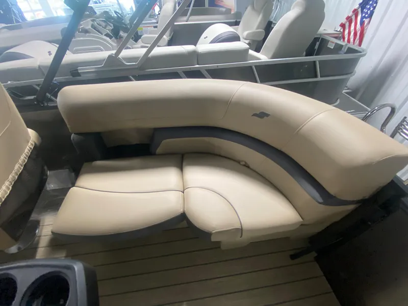 Slide: The Image of 2024 Starcraft EXS 1 boat with beige and gray seating. - 18