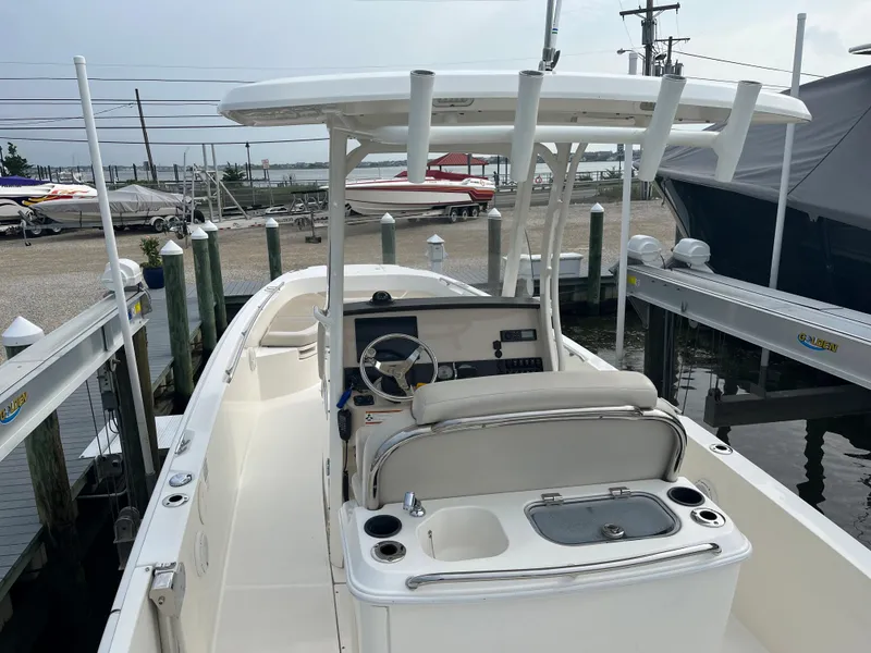 Slide: The Image of 2020 Boston Whaler 270 Dauntless boat docked at a marina. - 5