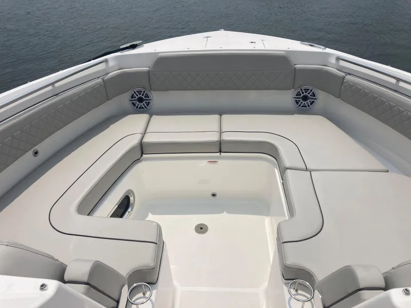 Slide: The Image of 2023 Pursuit DC 365 boat with spacious seating area. - 12