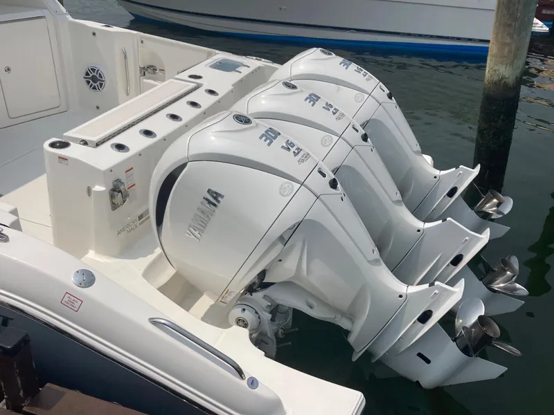 Slide: The Image of 2023 Pursuit DC 365 boat with triple Yamaha outboard engines. - 3