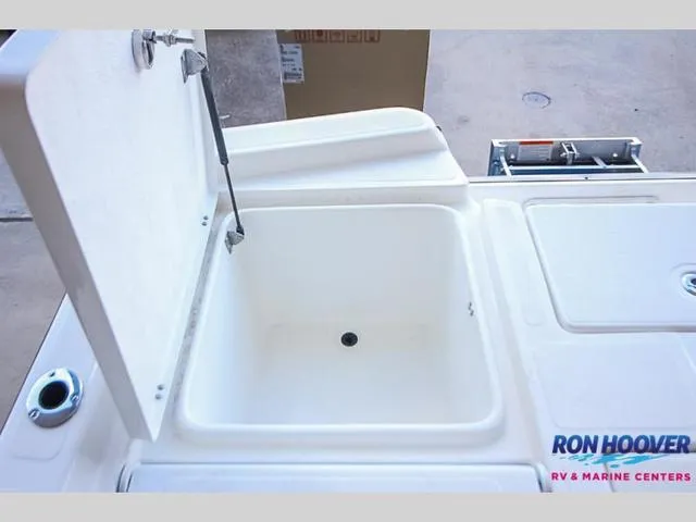 Slide: The Image of Open storage compartment on 2023 Catalyst Boat Works 2300 BAY. - 13