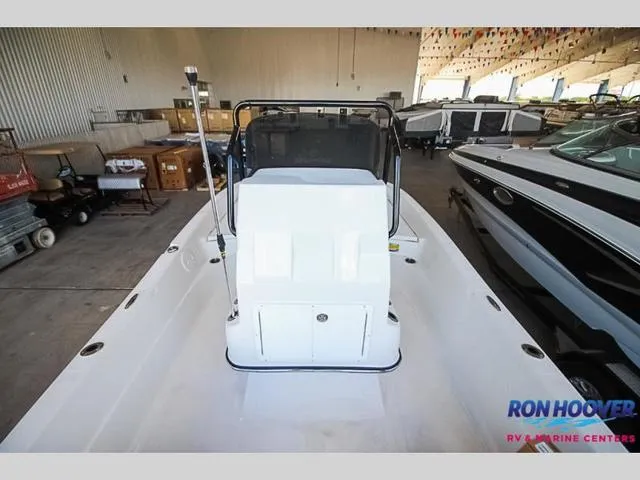 Slide: The Image of 2023 Catalyst Boat Works 2300 BAY in showroom, front view, white interior. - 16