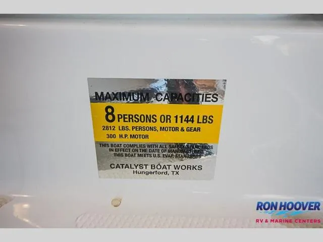 Slide: The Image of Capacity label for 2023 Catalyst Boat Works 2300 BAY, 8 persons or 1144 lbs. - 19