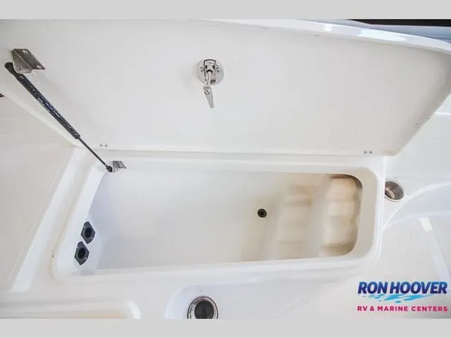 Slide: The Image of Open storage compartment on 2023 Catalyst Boat Works 2300 BAY. - 24
