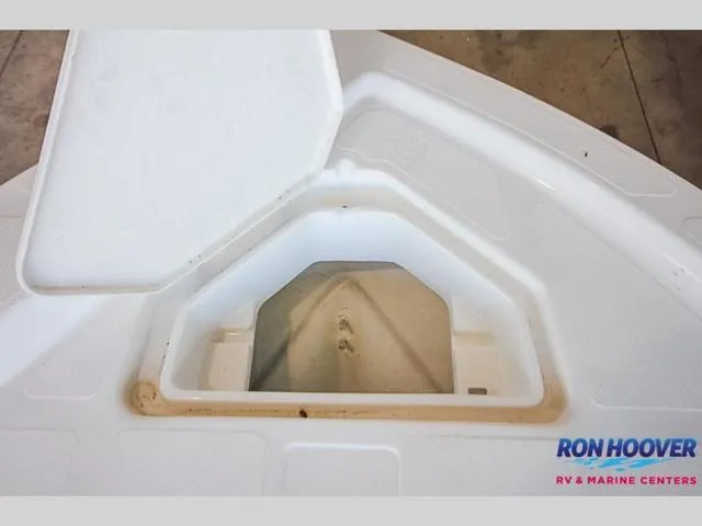 Slide: The Image of Open storage compartment on 2023 Catalyst Boat Works 2300 BAY. - 26